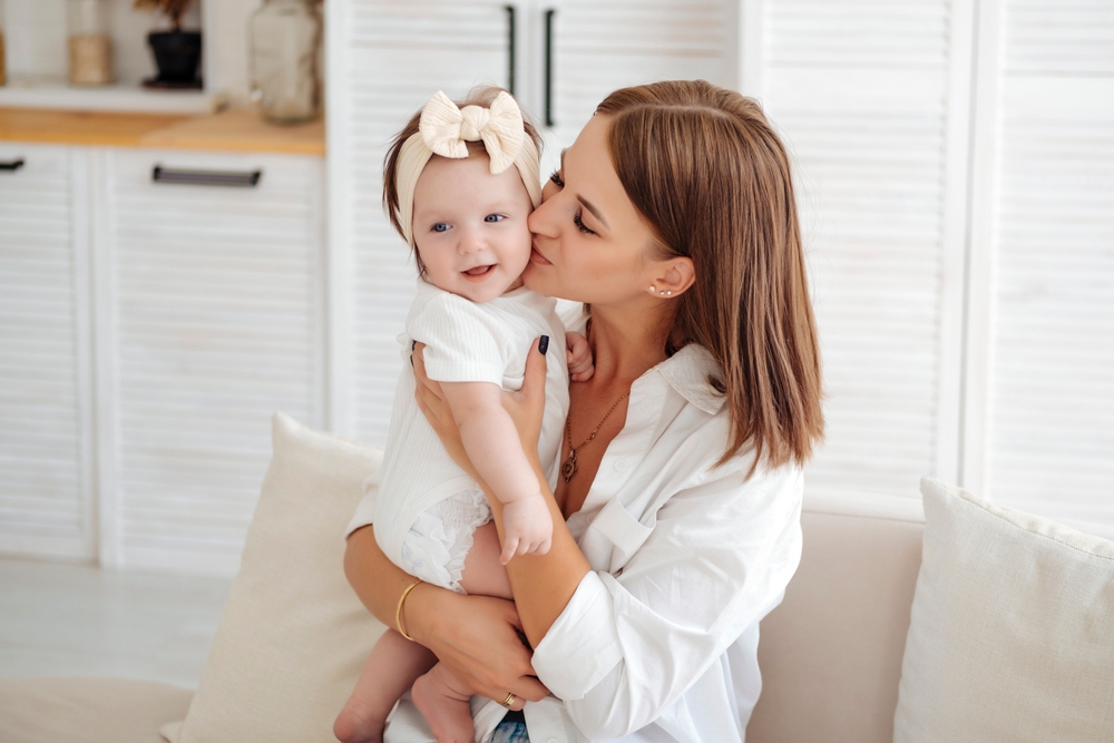 A portrait of a mother and a baby for the page of Niral A. Patel DDS